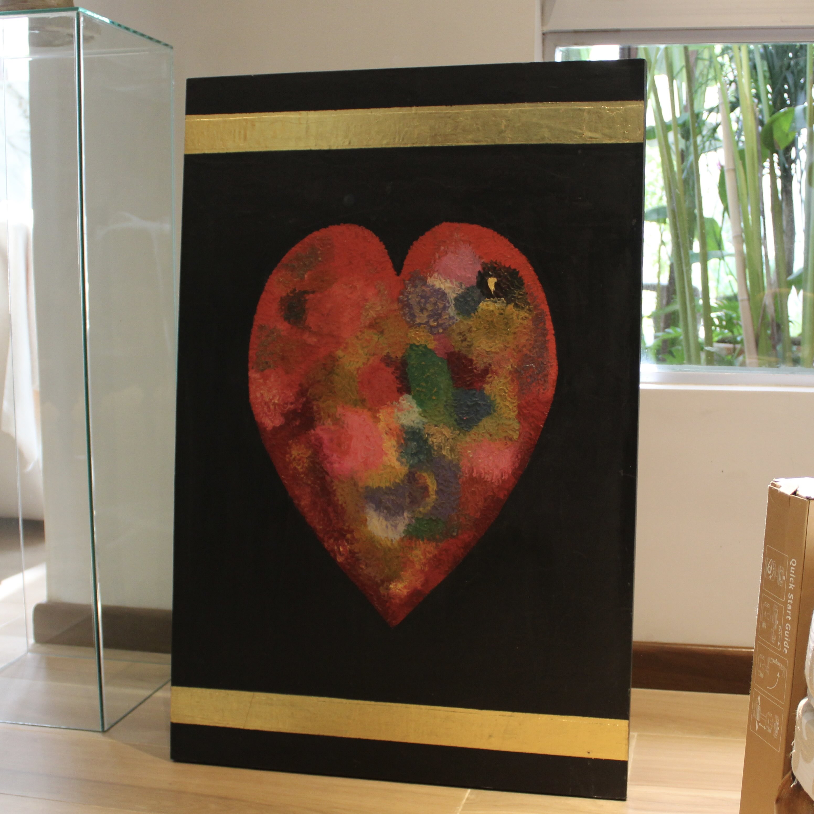 Cuadro de corazón con lingotes de oro